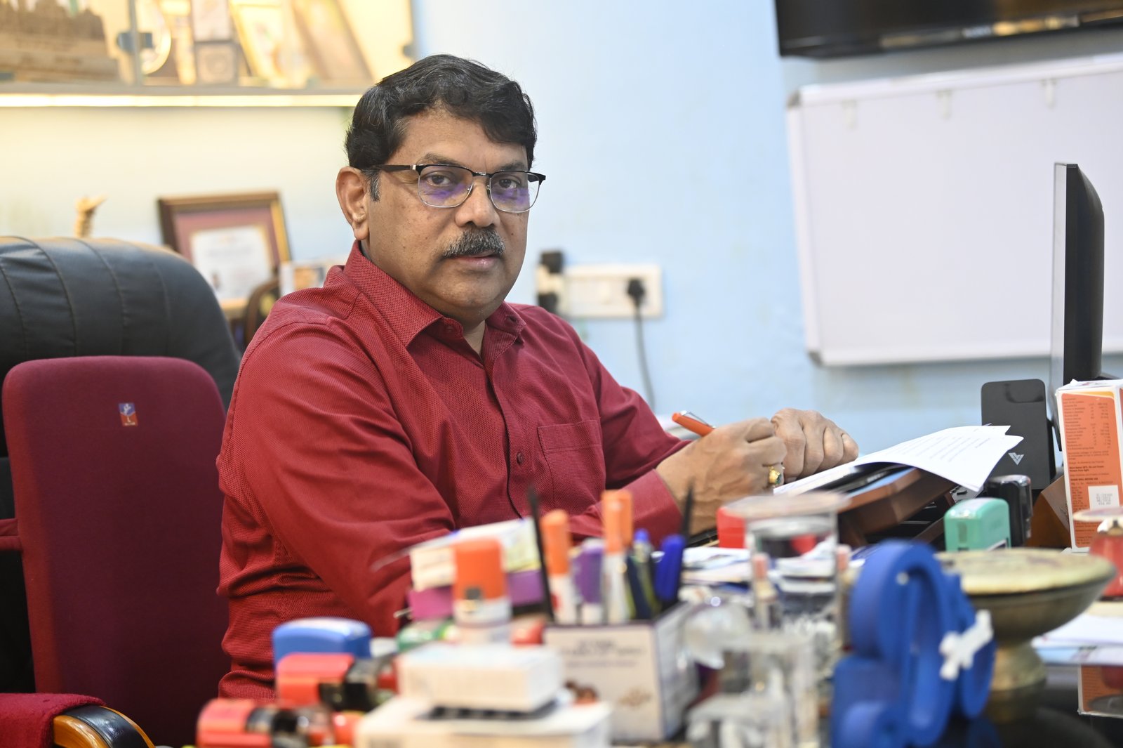 Dr Jayanta K. Panda at clinic desk